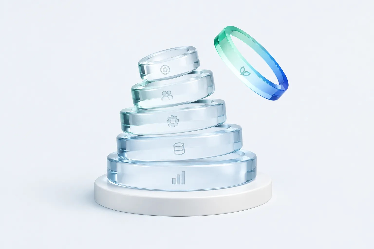A spiral stack of five glass rings, each etched with a different mark, with one ring tilted apart from the rest.